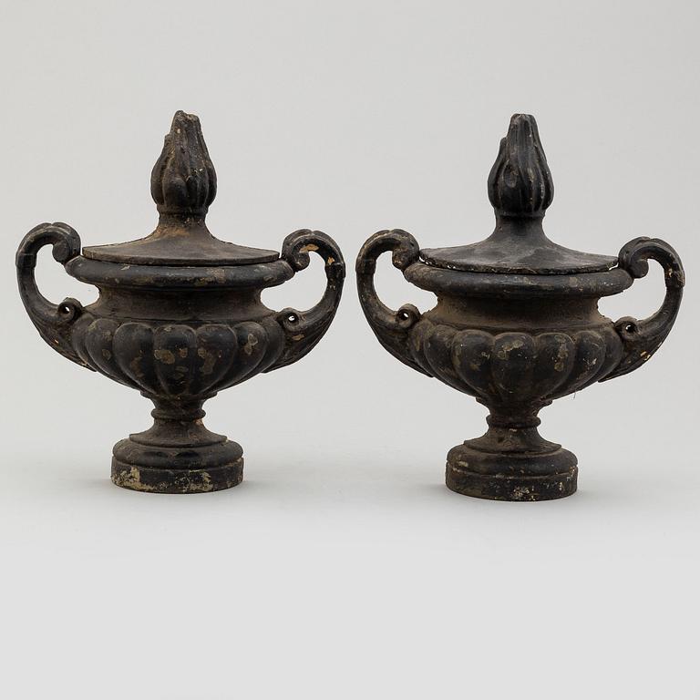 A pair of cast iron decor elements, ca 1900.