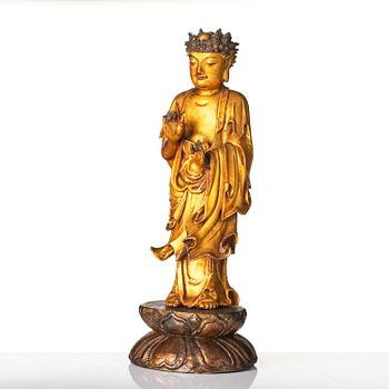 A lacquer figure of a standing Buddha, late Ming dynasty/early Qing dynasty.
