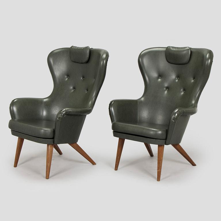 A pair of mid-20th century armchairs.