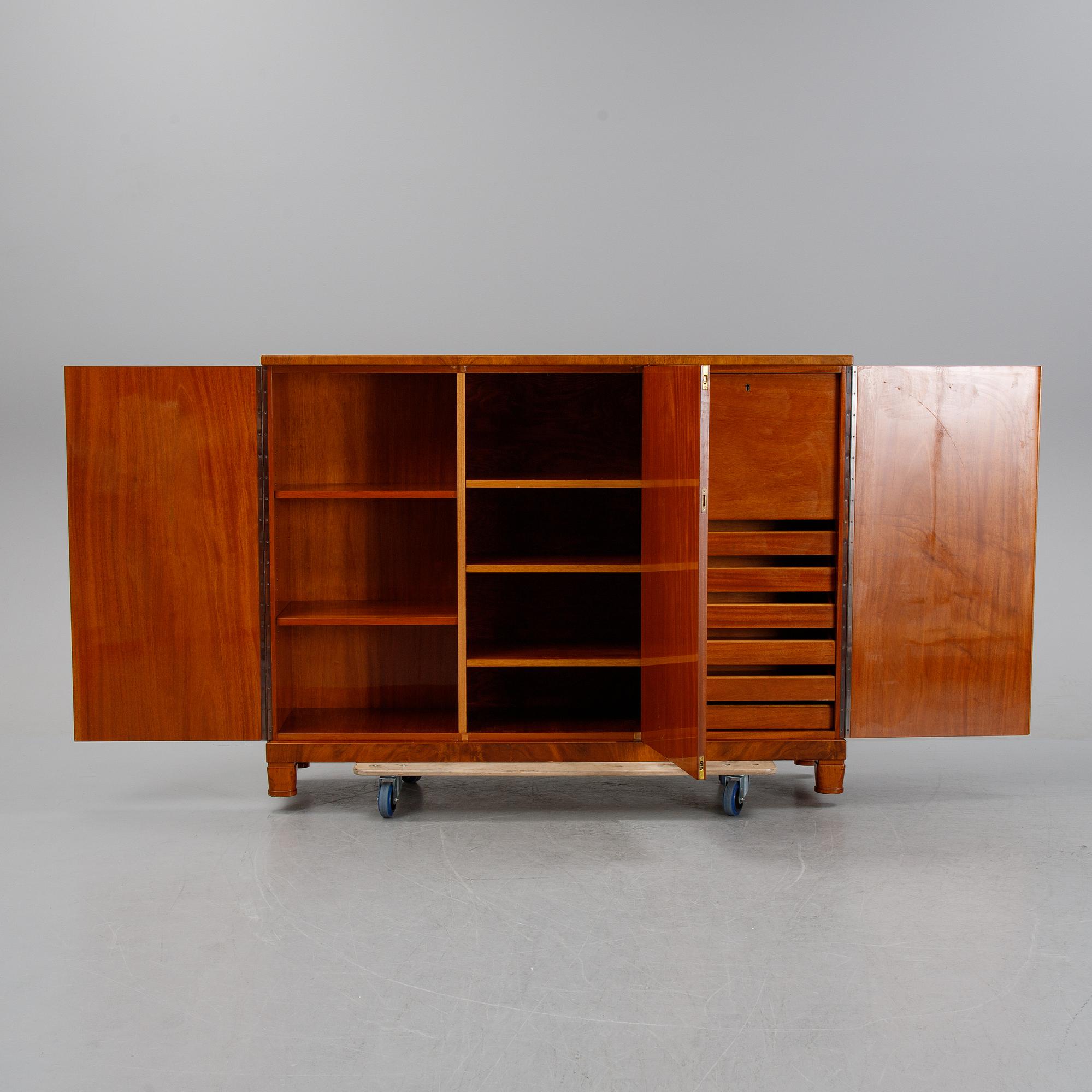A 1940's Swedish Modern mahogany veneered cabinet.
