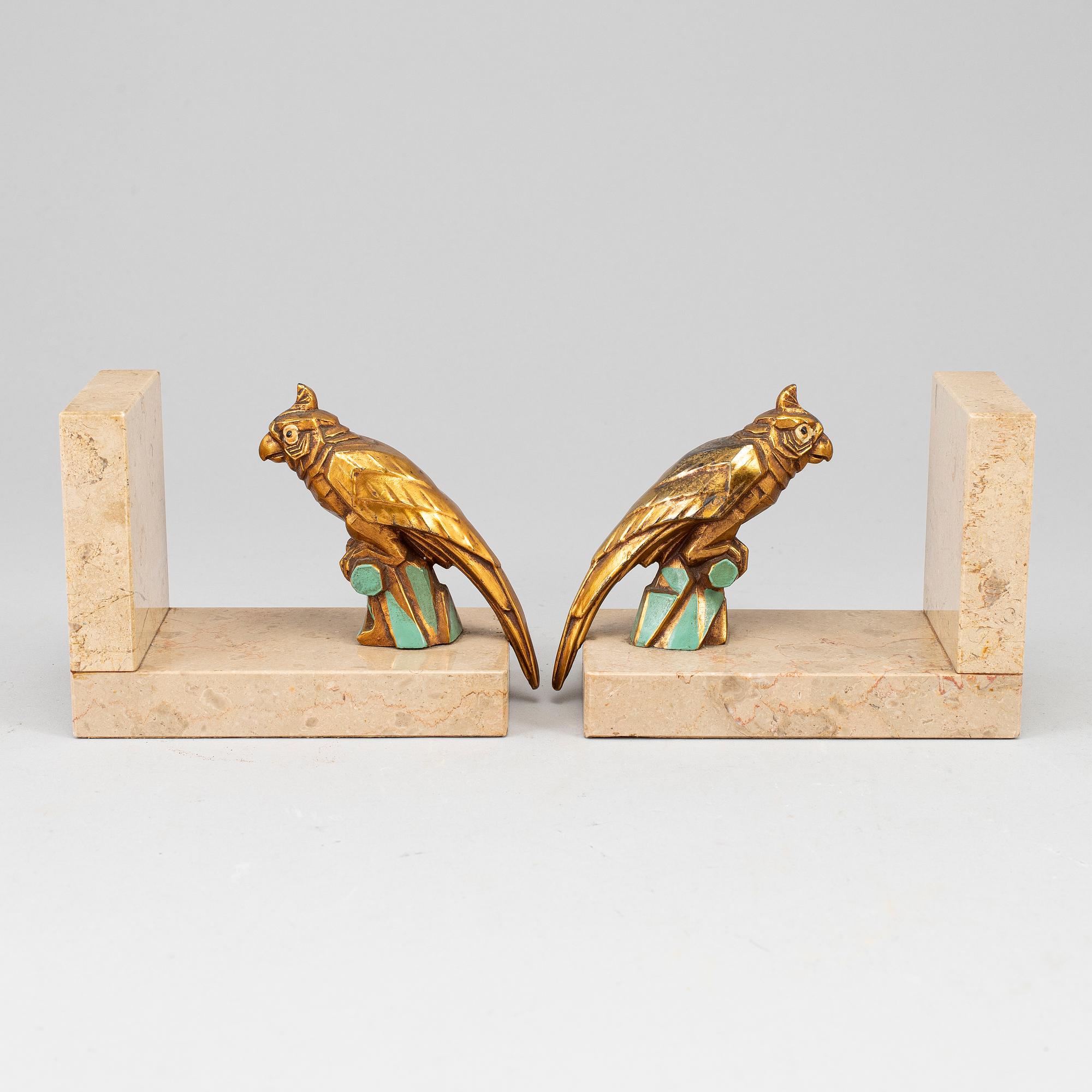 A pair of art déco painted metal and marble books ends, 1930s.