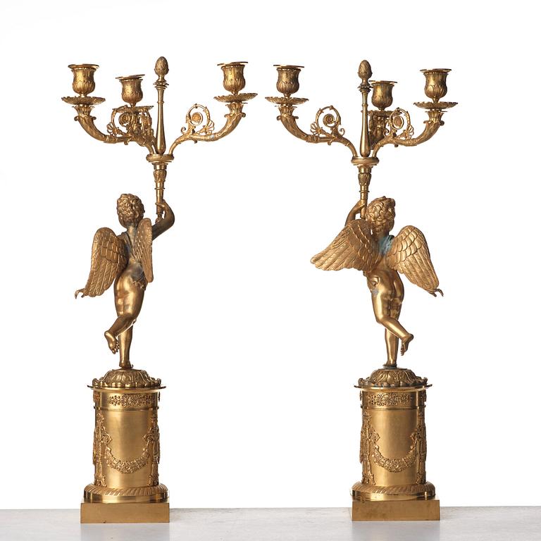 A pair of French Empire three-light candelabra, early 19th century.