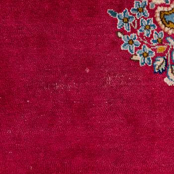 A Kirman carpet, signed, c. 388 x 279 cm.