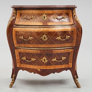 A Swedish rosewood-veneered Rococo chest of drawers, later part of the 18th century.