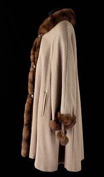 568. A 1980s fur-trimmed beige silk and wool cape by Louis Féraud.