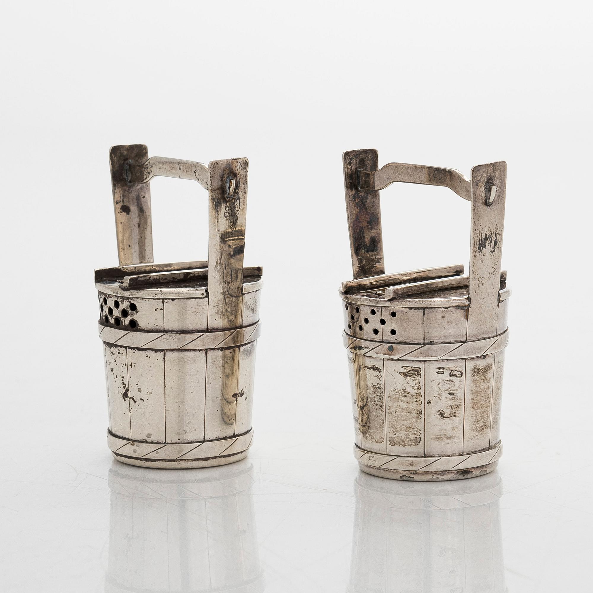 A pair of sterling silver salt- and pepper shakers , Japan, latter half of the 20th century.