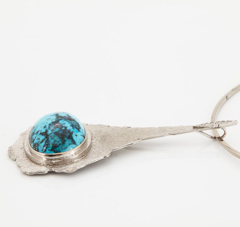 A Grima turquoise pendant with a choker.