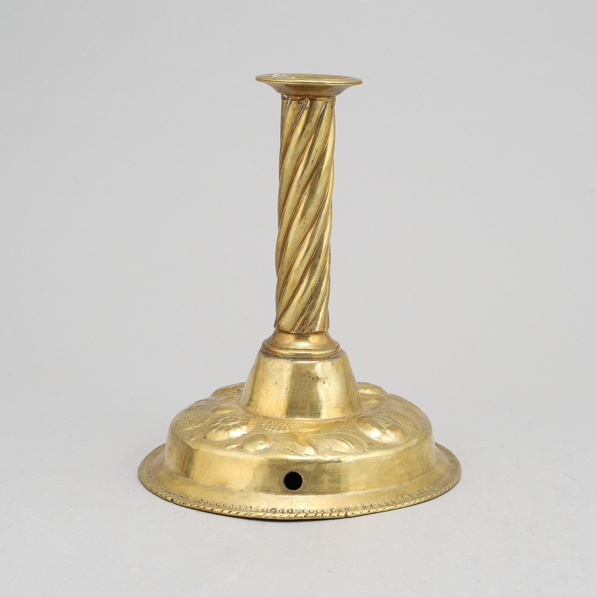 A 19th Century baroque style candlestick, with older parts.