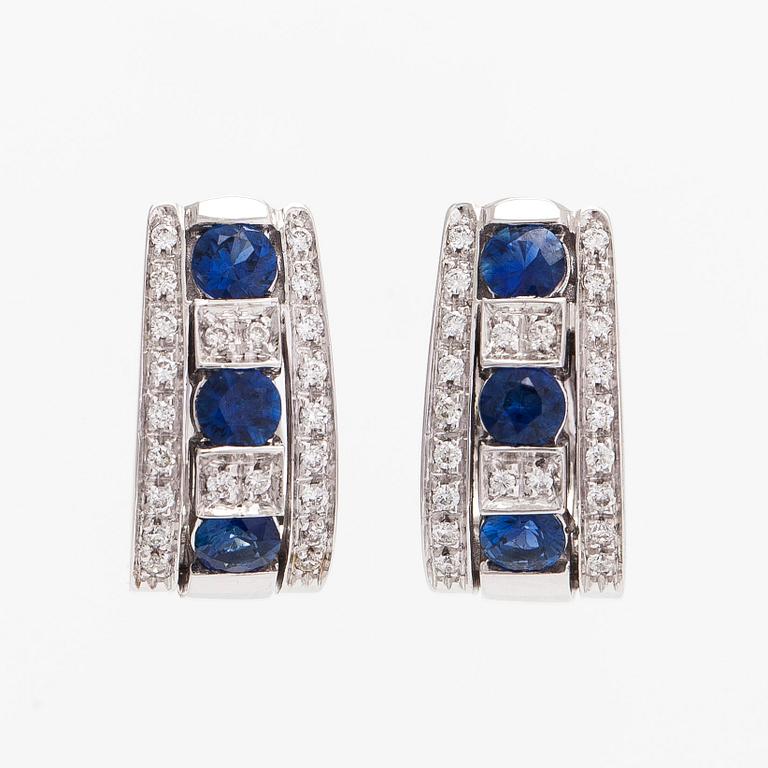 Earrings 18K white gold with faceted sapphires and round brilliant-cut diamonds.