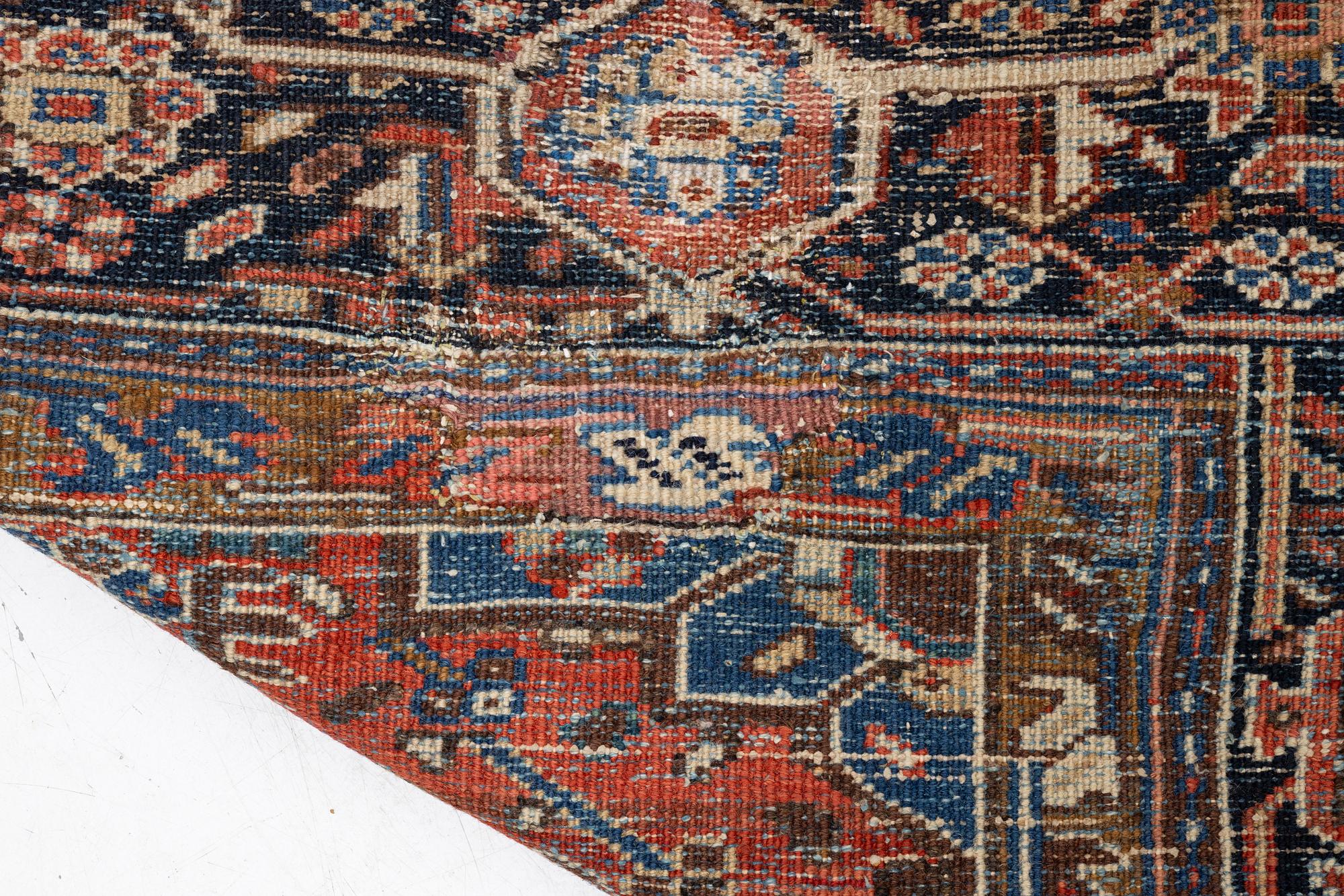 An antique Heriz carpet, west Persia, c. 333 x 238 cm.