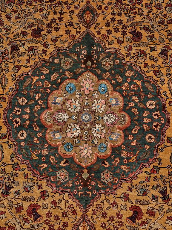 A rug, a semi-antique silk Turkish with metal brocade, ca 194-195 x 127,5-132,5 cm.