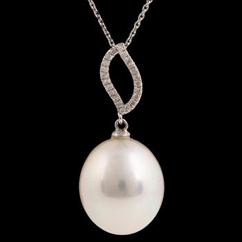 A large cultured South sea pearl and diamond pendant.