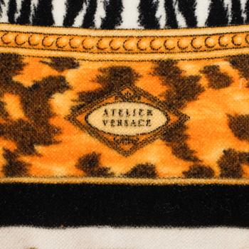 VERSACE, a velvet pillow.