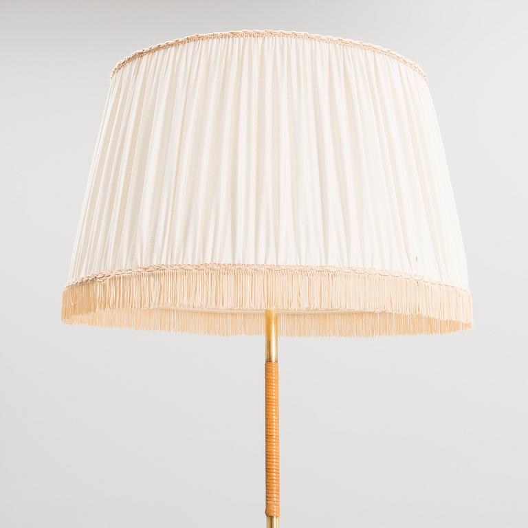 PAAVO TYNELL, A FLOOR LAMP. Manufactured by Idman.