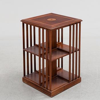 A mahogany veneered revolving bookcase, late 20th Century.