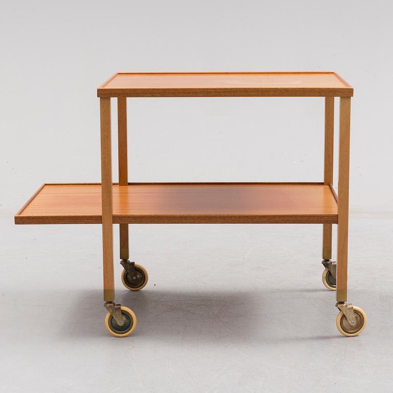 A mahogany veneer tea trolley designed in 1932 by Josef Frank for Firma Svenskt Tenn.