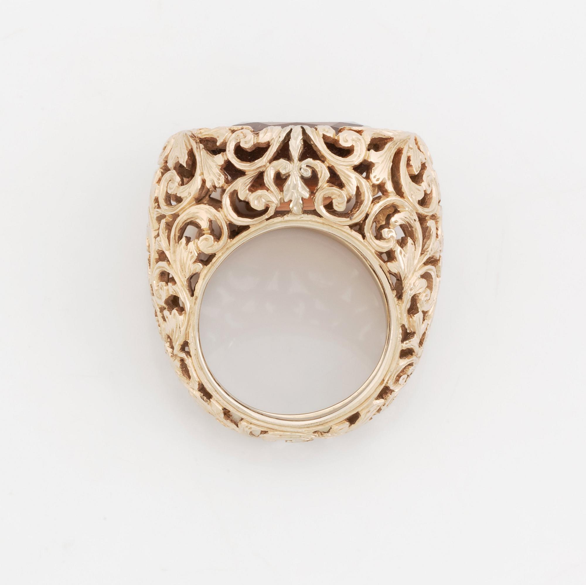 A Tina Karlsson 18K gold ring set with a faceted zircon.