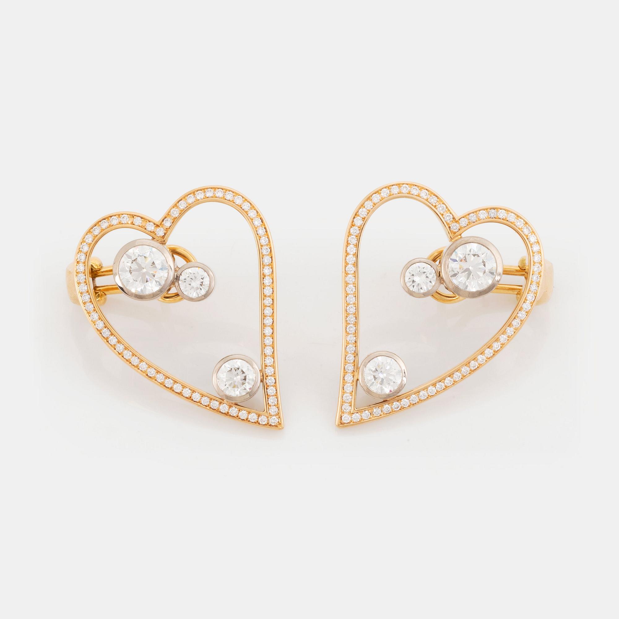 WA Bolin a pair of earrings in 18K gold and white gold set with round brilliant-cut diamonds.