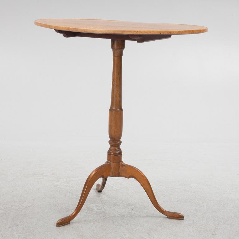 A 19th Century birch tilt top table.