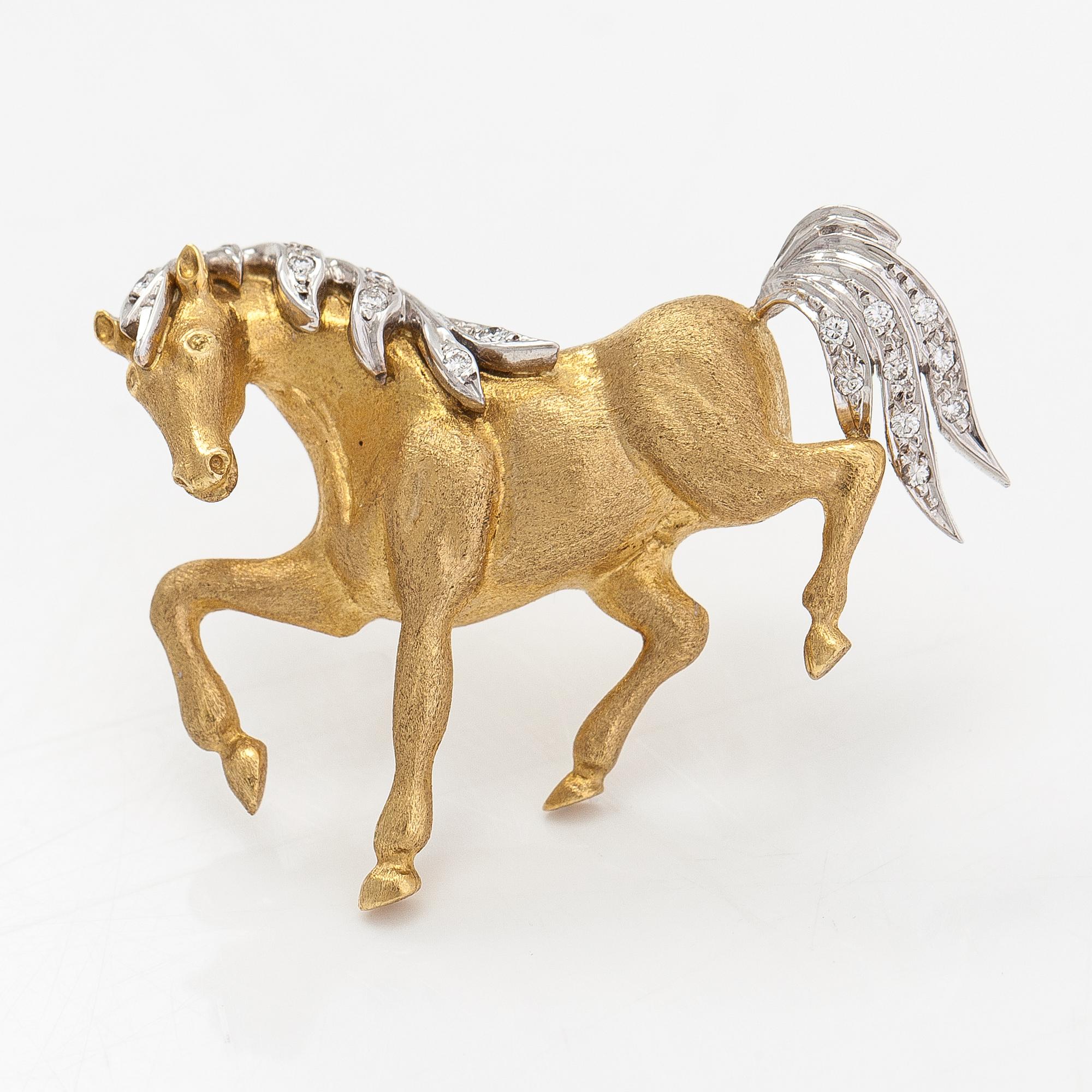 An 18K gold horse brooche with diamonds ca. 0.04 ct in total. United Kingdom.