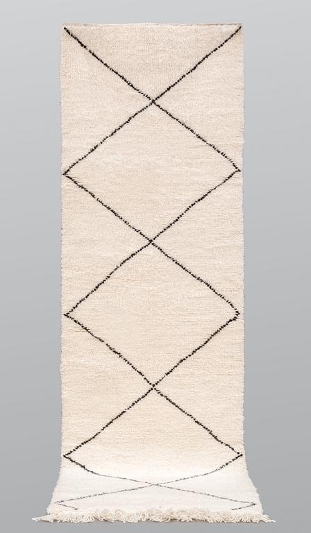 A Moroccan runner carpet, 300 x 88 cm.