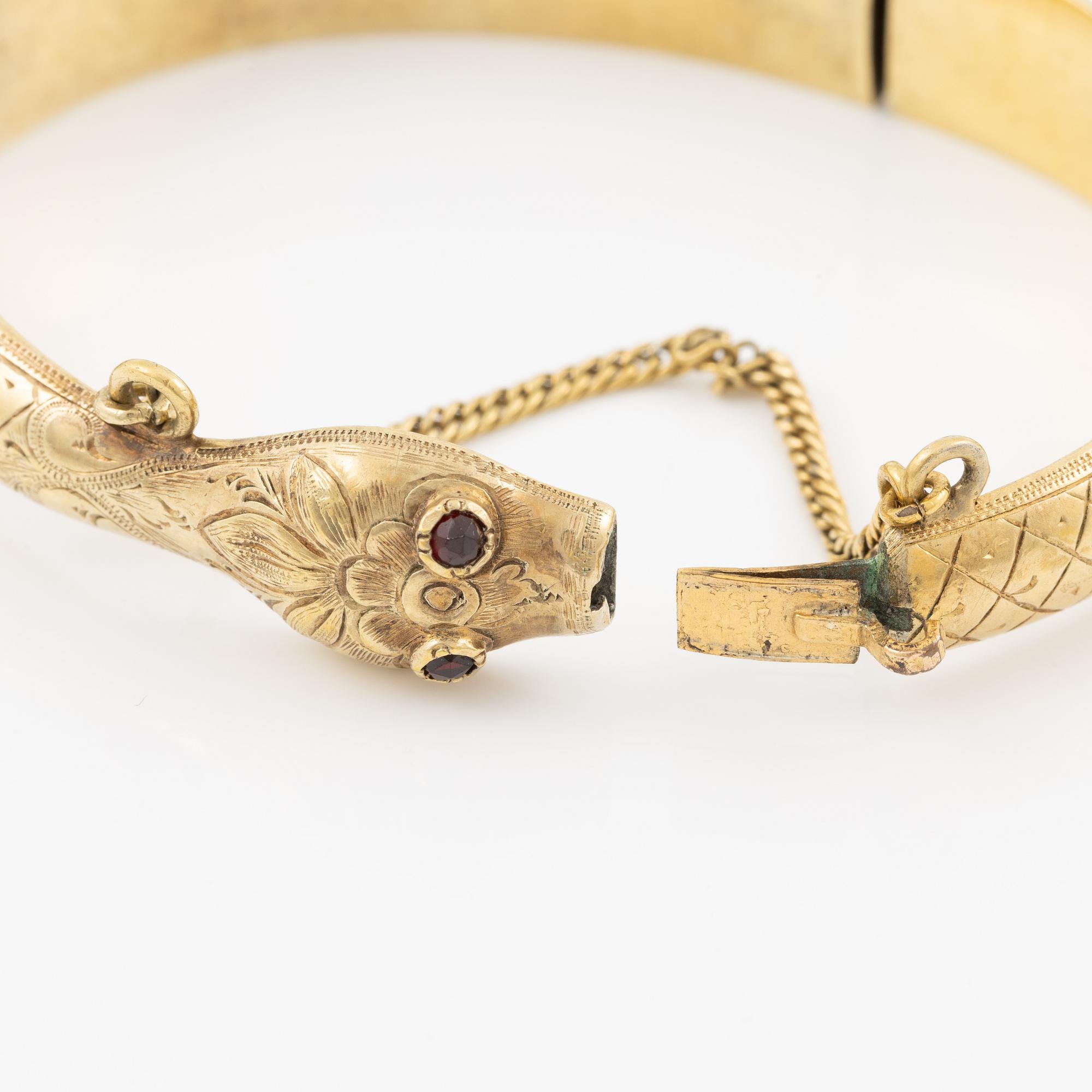 Armring in the form of a serpent, 18K gold with garnets as eyes, Johan Gustaf Kihlberg, Nyköping 1863.