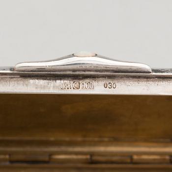 Three silver cigarette cases and a silver pillbox, marked in Finland and Germany, first half of the 20th Century.
