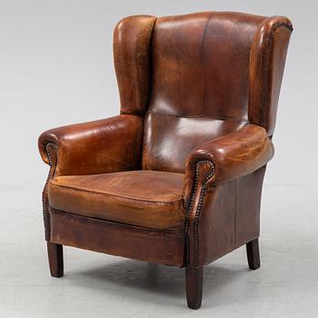 A leather upholstered easy chair , second half of the 20th Century.