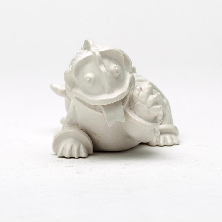 Wilhelm Kåge, a set of stoneware figures of a 'dragon puppy' and two 'dragon puppies' with candle holders, Gustavsberg, ca 1940.