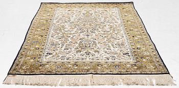 A Ghom, silk rug, c. 215 x 140 cm.