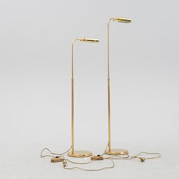 A pair of brass floor lamps, late 20th Century.