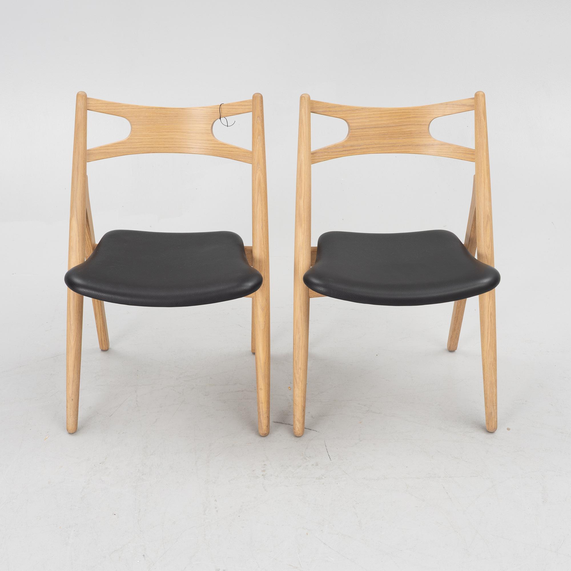 Hans J Wegner, a pair of chairs, model CH 29 "The Savbuk Chair", Carl Hansen.