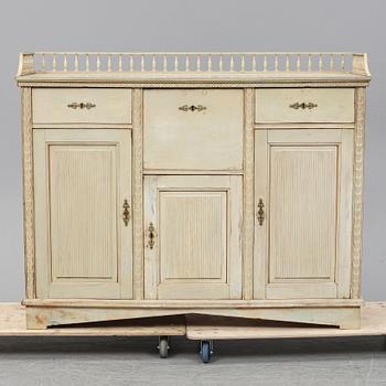 An early 19th Century painted late Gustavian cupboard.