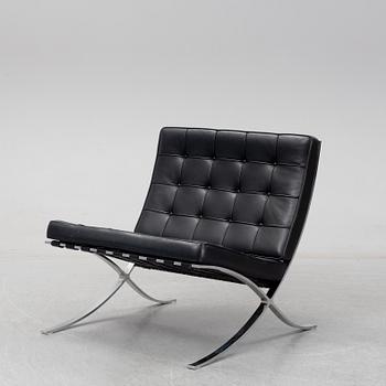 LUDWIG MIES VAN DER ROHE, a 'Barcelona' black leather lounge chair, Knoll Studio.