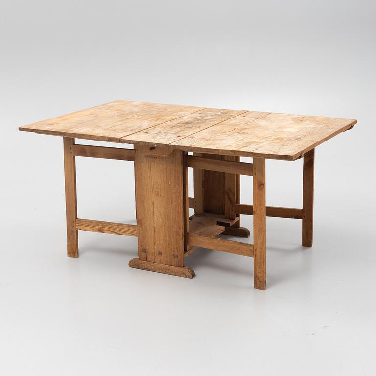 A gate-leg table, around 1900.