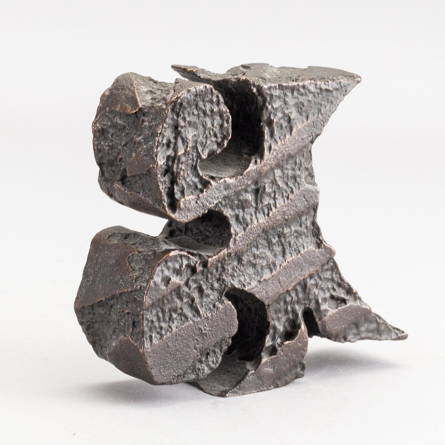 An signed and numbered bronze sculpture '23' by Carl Fredrik Reuterswärd.