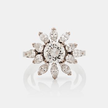 A older brilliant-, marquise-, and pear- cut diamond ring. Center diamond circa 1.20 cts.