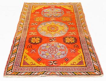 A Carpet, Khotan (?), 217 x 108 cm.