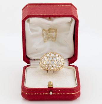 Cartier "Marrakech" an 18K gold bombé ring set with round brilliant-cut diamonds.