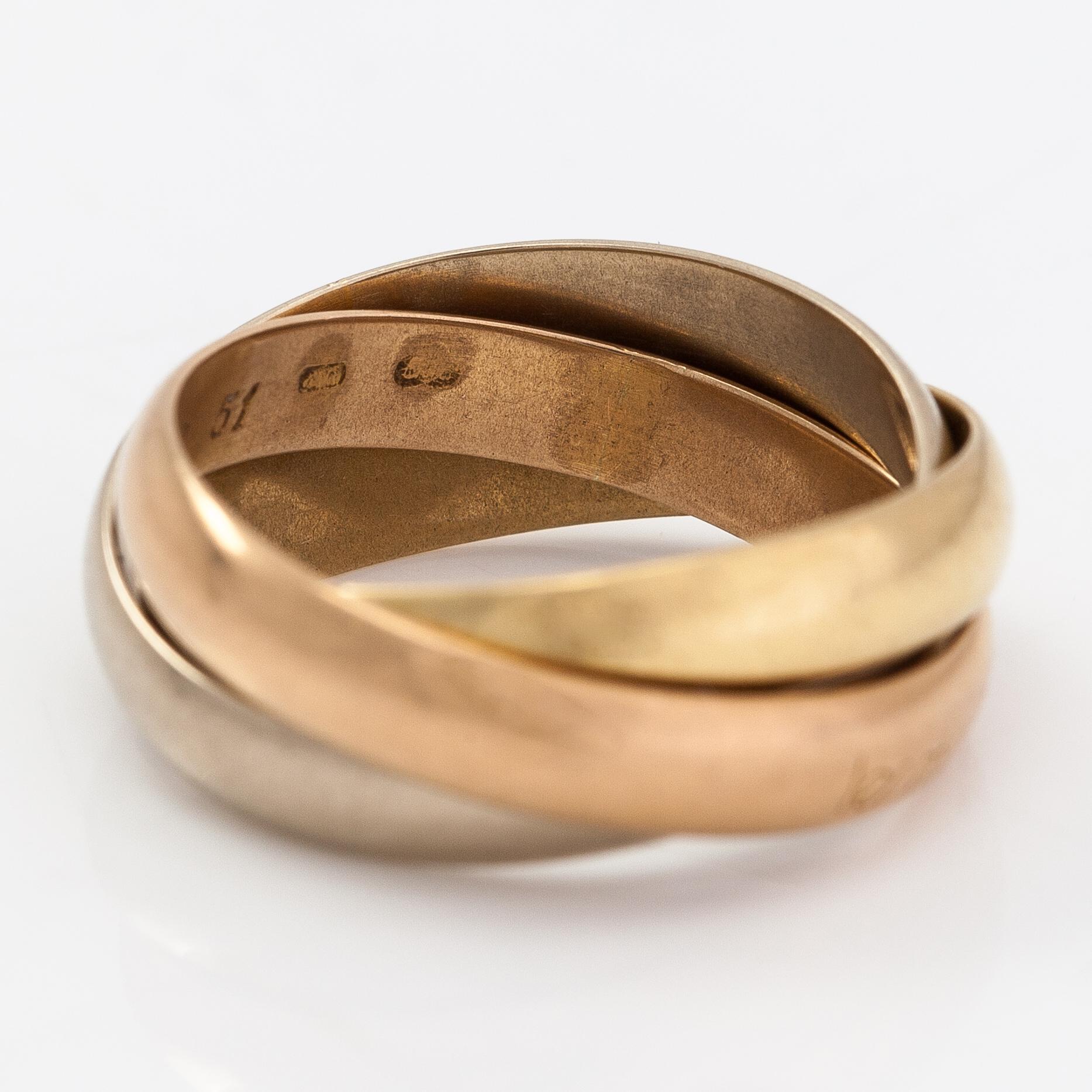 must de Cartier, An 18K gold "Trinity" ring.
