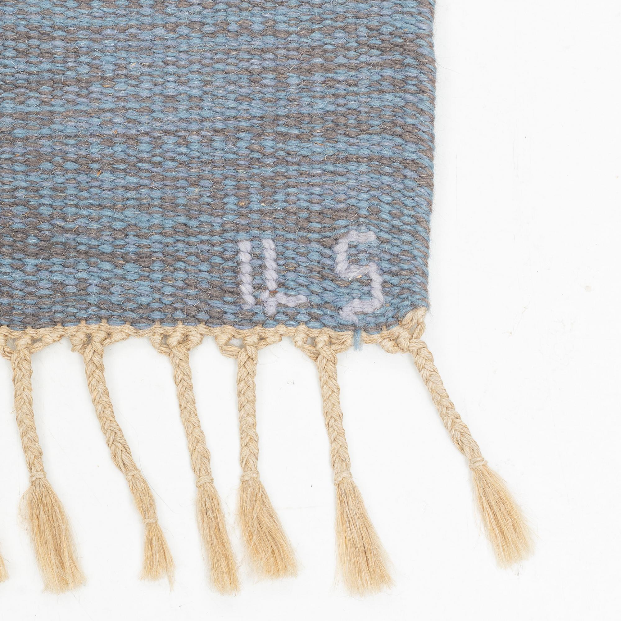 A flat weave carpet, signed  ILS, Alestalon Mattokutomo, Kauhava, Finland, c.  230 x 158 cm.