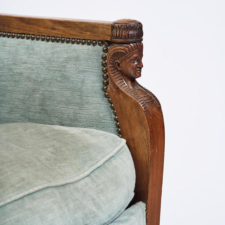 A pair of French Empire mahogny armchairs.