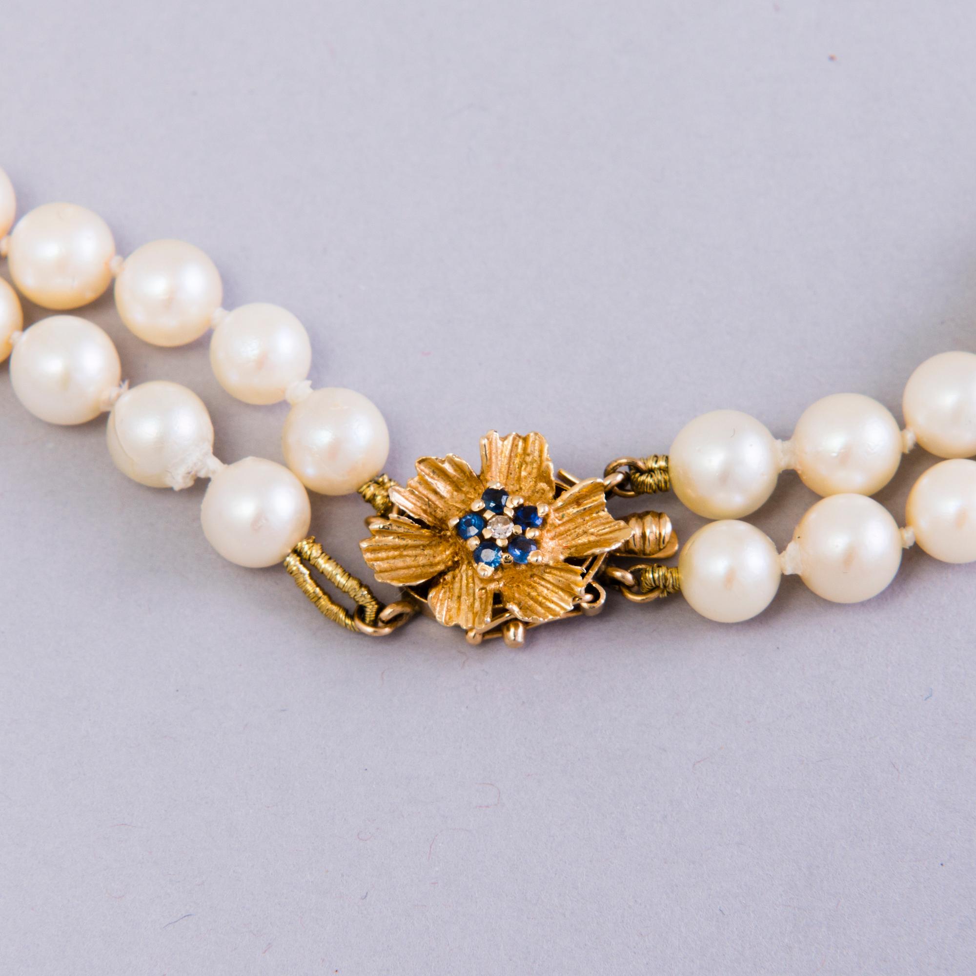 Double-strand cultured pearl necklace, clasp in 14K gold, Seaborne, Usa.