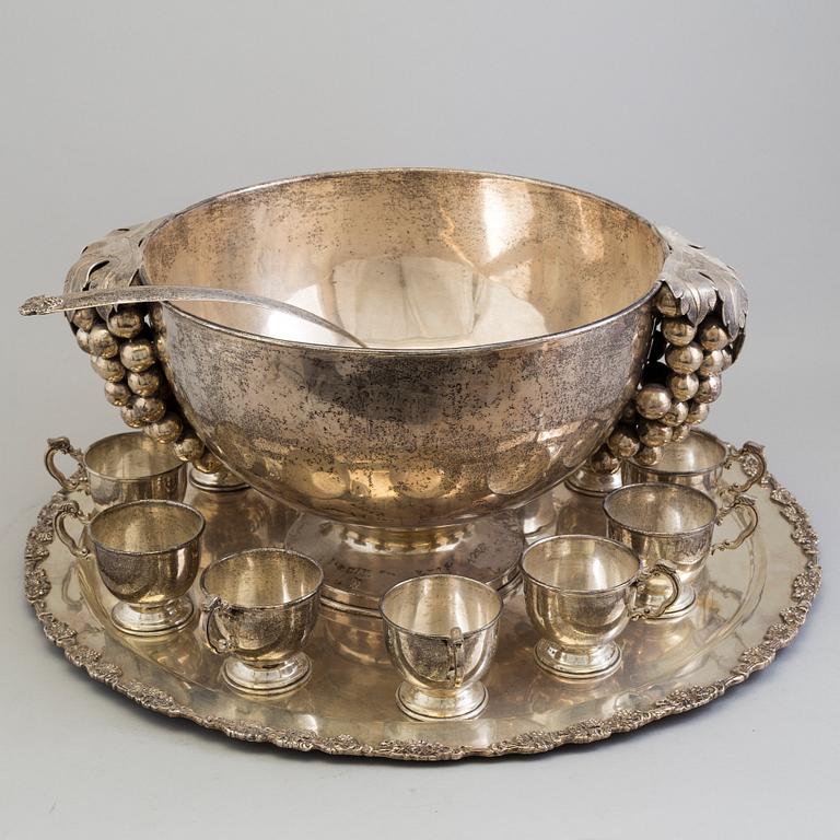 A first half of the 20th century silver punch bowl with twelve cups.