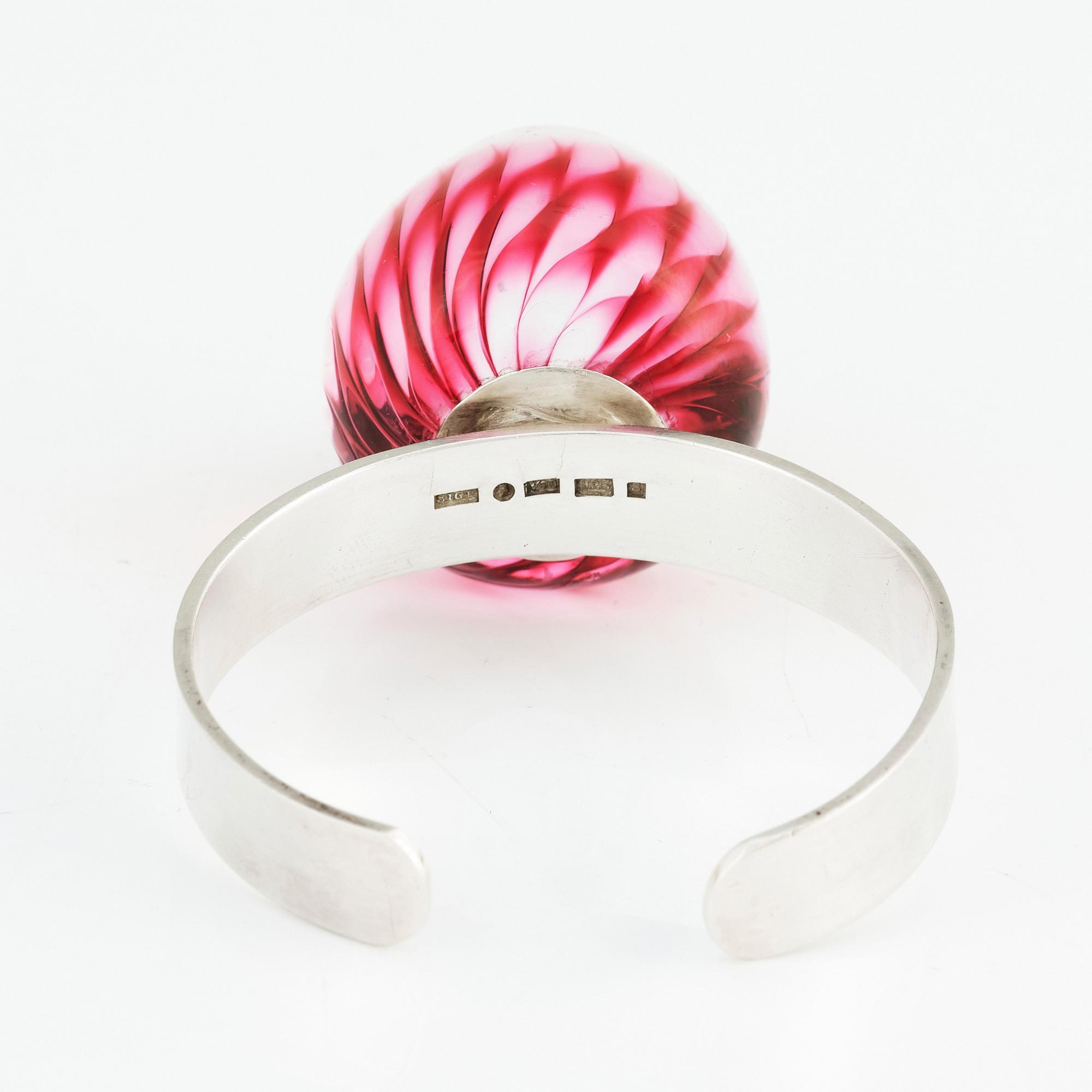 Sigurd Persson, a sterling silver bangle crowned with a strawberry coloured glass ball, Stockholm 1995.