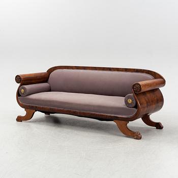 An Empire sofa, first part of the 19th Century.