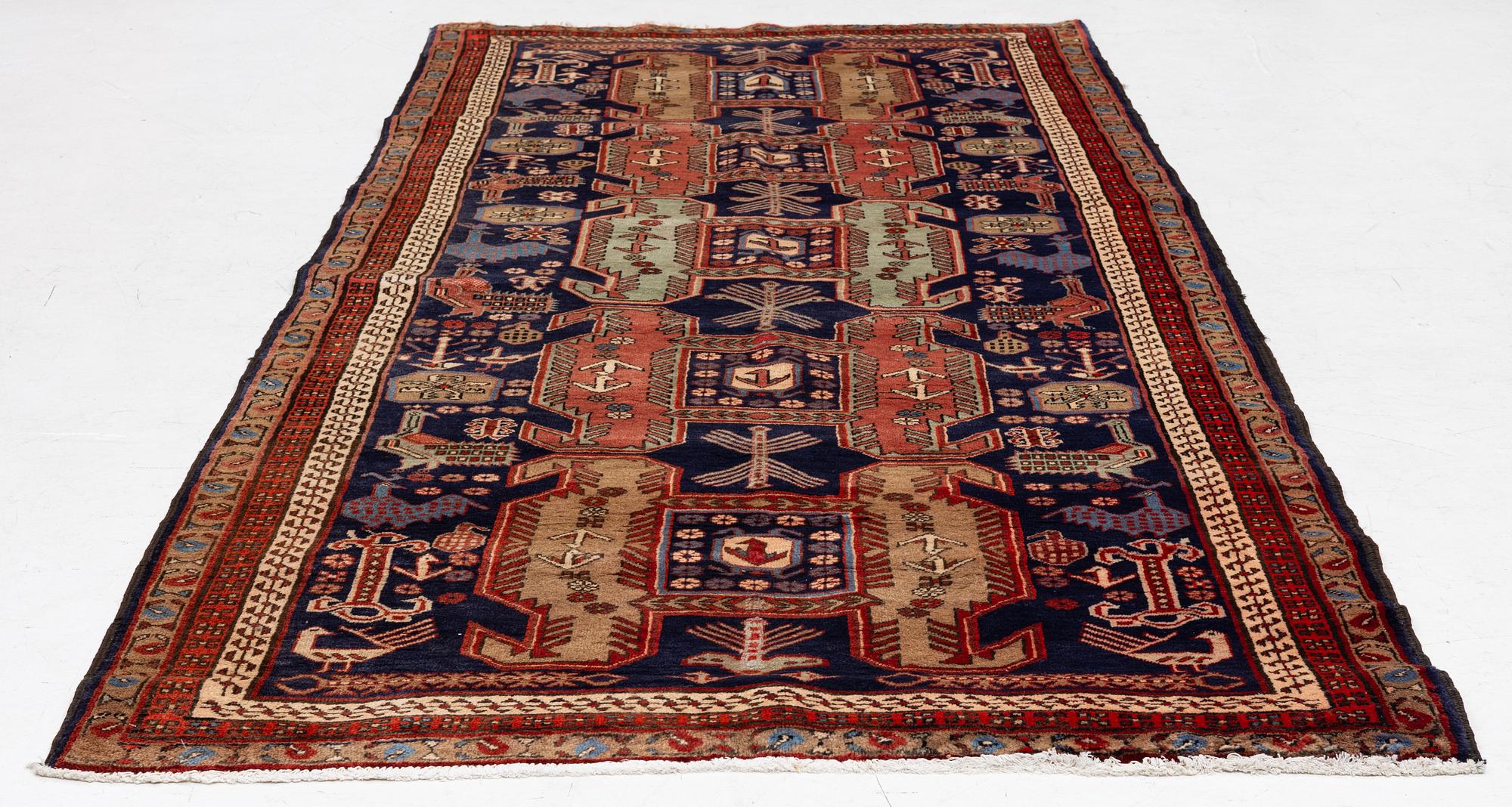A Sarab carpet, c. 305 x 137 cm.