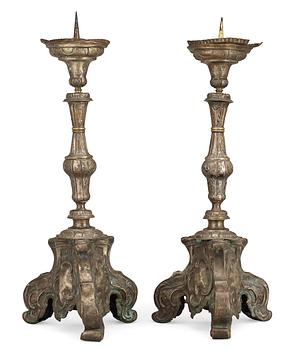 516. A pair of Baroque 18th Century altar candlesticks.