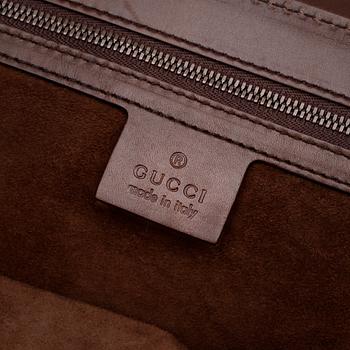 GUCCi, a brown leather shoulder bag.