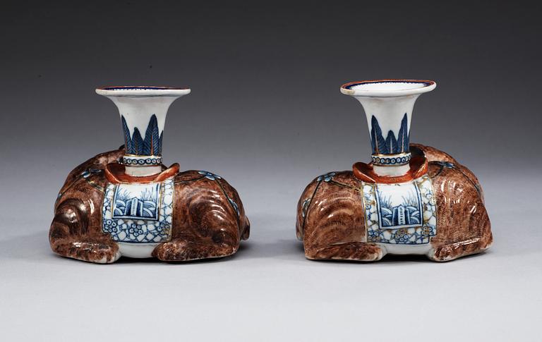 A pair of famille rose candlesticks in the shape of elephants, Qing dynasty, Qianlong (1736-95).